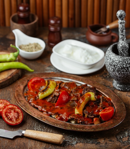 fried meat in a sauce with vegetables