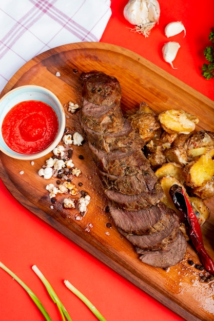 Fried meat slices with potatoes