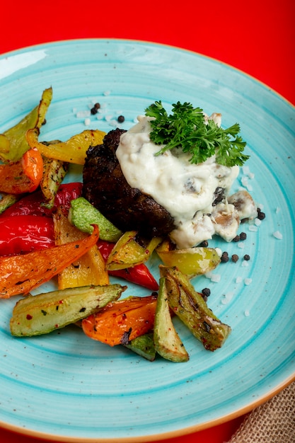 Fried meat and vegetables and herbs