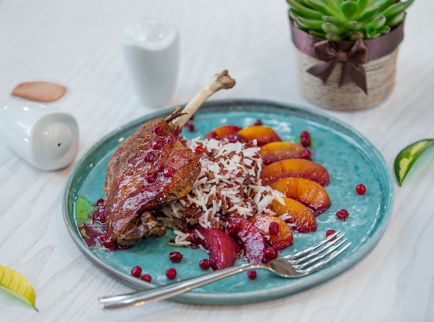 fried meat with apples and rice