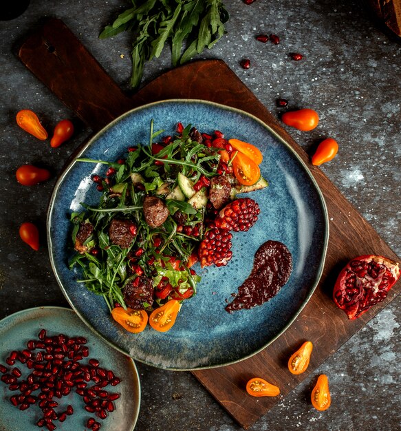 Fried meat with herbs and pomegranate