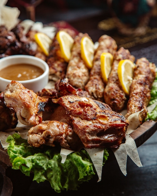 Fried meat with lemon and sauce