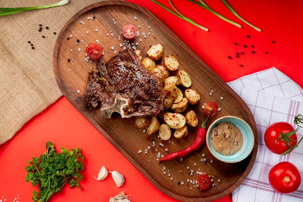 Fried meat with potato and red pepper