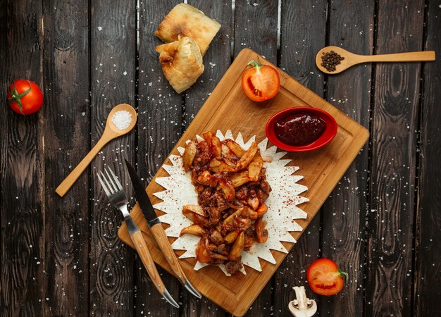 Fried meat with potato on the table