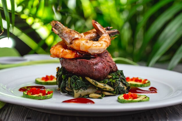 Fried meat with prawns zuccihni spinach mushroom side view