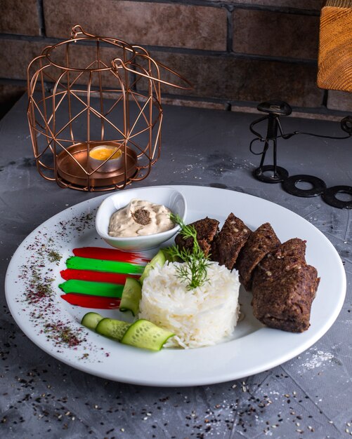 Fried meat with rice on the table