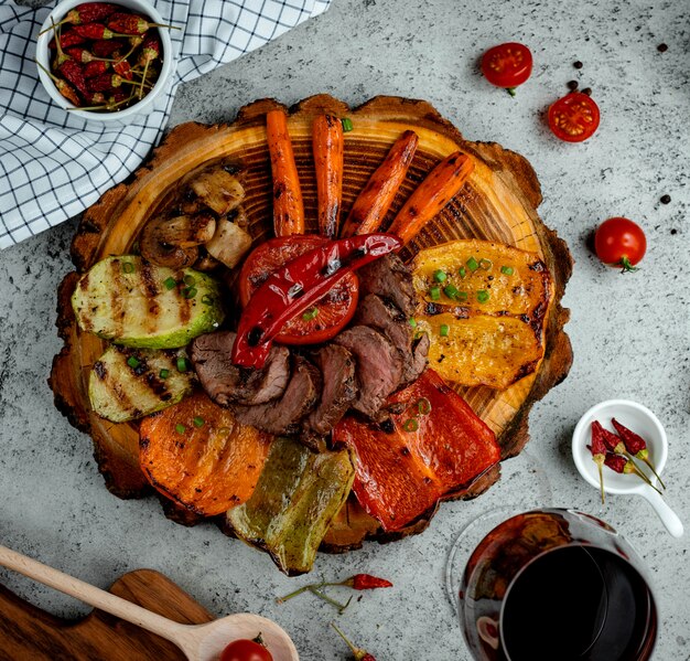 Fried meat with vegetables on the table