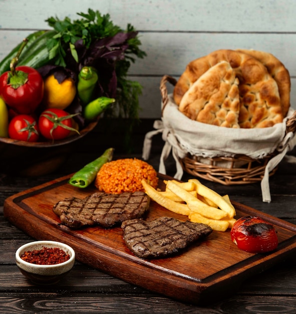 Fried meat on wooden board