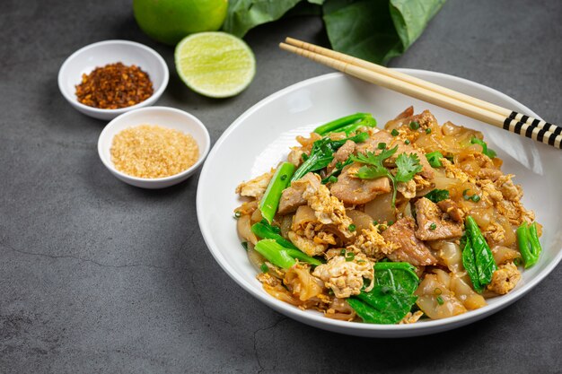 Fried noodle with pork in soy sauce and vegetable