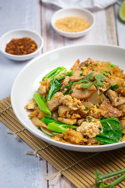 Fried noodle with pork in soy sauce and vegetable