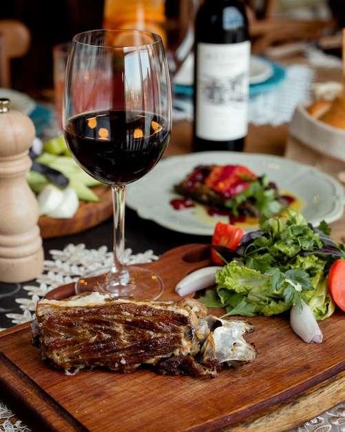 Fried piece of meat with vegetables on the table