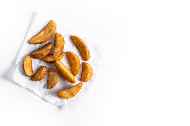 Free photo fried potato wedges isolated on white background