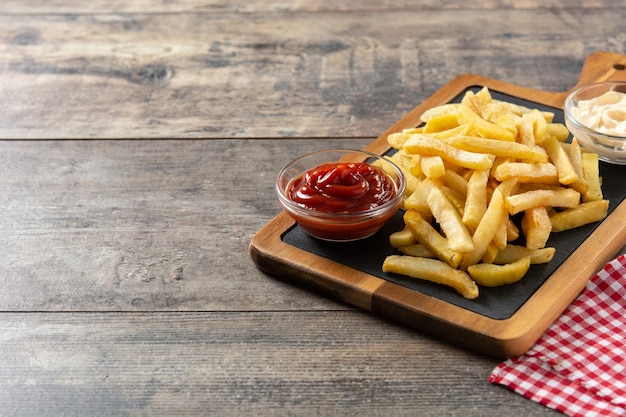 Fried potatoes with ketchup and mayonnaise