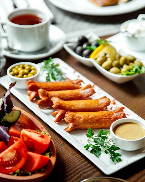 Fried sausages and vegetables