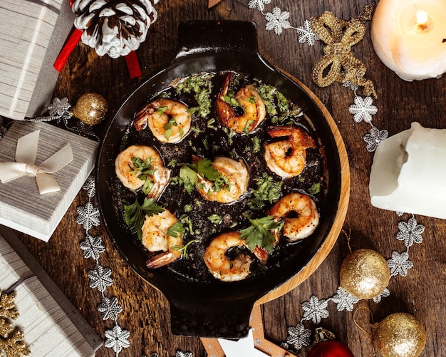 Fried shrimps topped with herbs