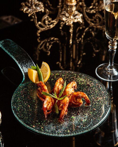 fried shrimps with lemon on the table