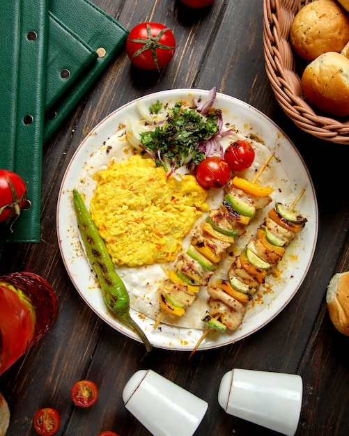 Fried vegetables on stick and mash