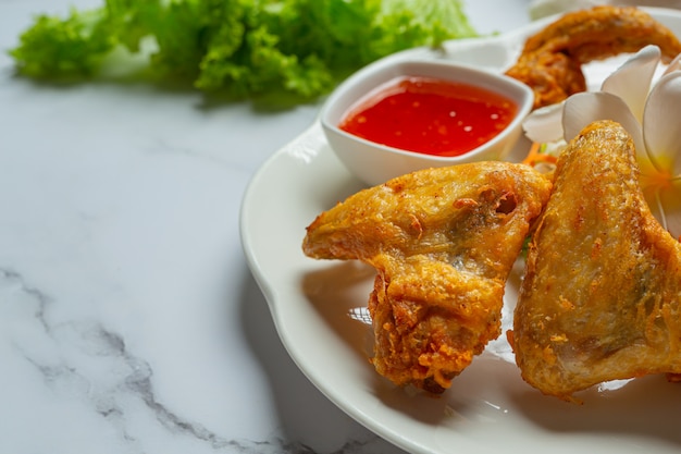 Fried wings with fish sauce, beautifully decorated and served.