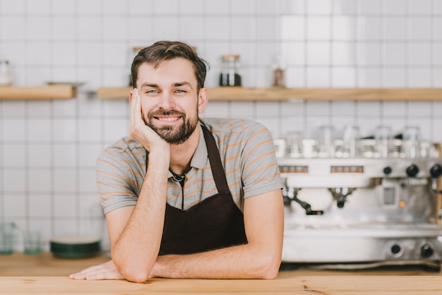 Free photo friendly bartender behind counter