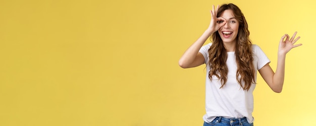 Free photo friendly charismatic enthusiastic happy woman having perfect day show okay ok circle gesture look