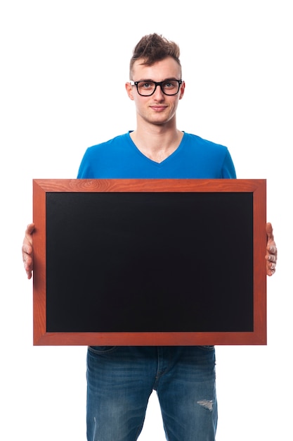 Free Photo friendly man holding blank blackboard