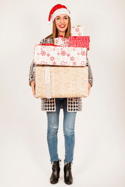 Free photo friendly woman holding presents