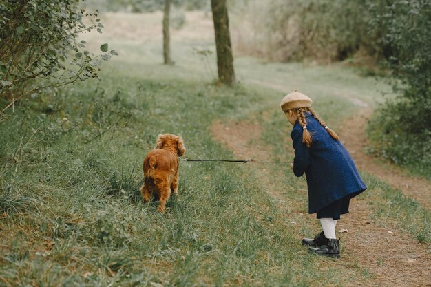 Friends are having fun in the fresh air. Child in a blue coat.