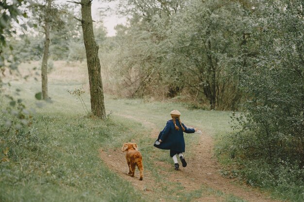 Friends are having fun in the fresh air. Child in a blue coat.