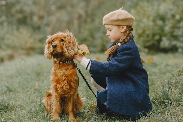 Free Photo friends are having fun in the fresh air. child in a blue coat.