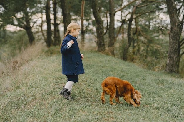 Friends are having fun in the fresh air. Child in a blue coat.