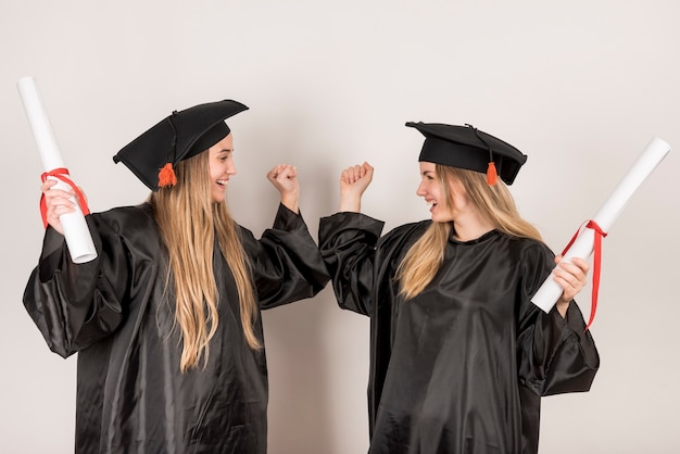 Free photo friends being cheerful at graduation ceremony