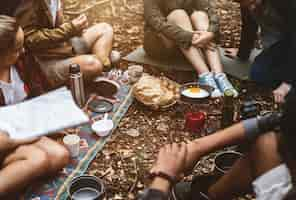 Free photo friends camping in the forest together