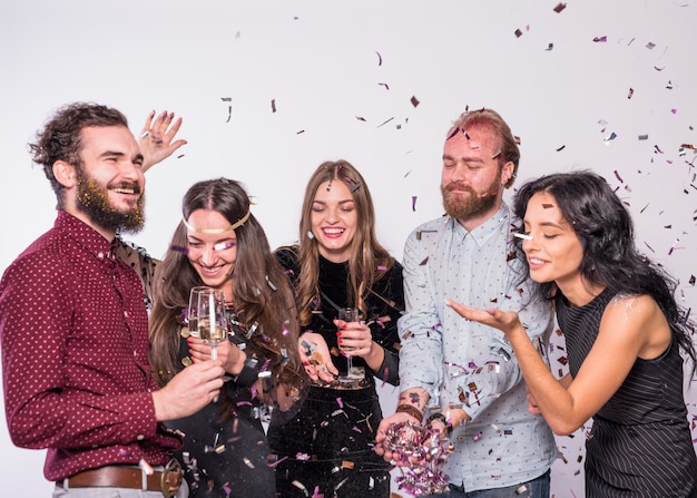 Friends catching confetti on party