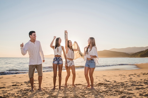 Friends celebrating on the beach