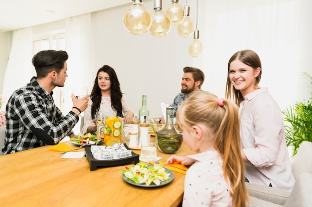 Friends chatting sitting at table