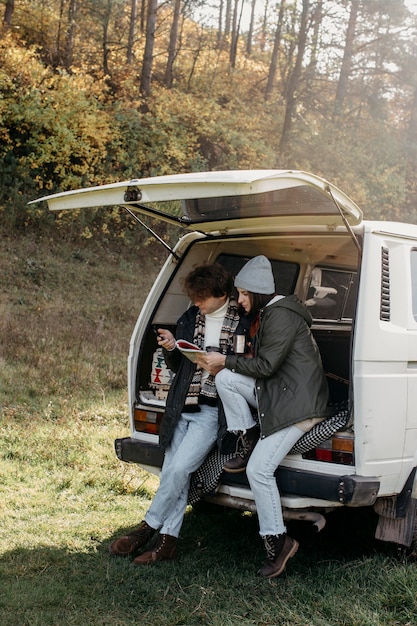 Friends checking a map while having a road trip