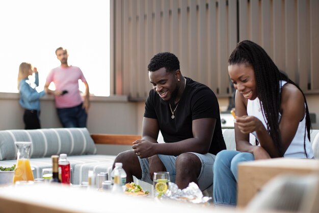 Friends cooking together on a barbecue