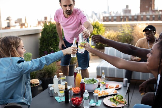 Friends cooking together on a barbecue