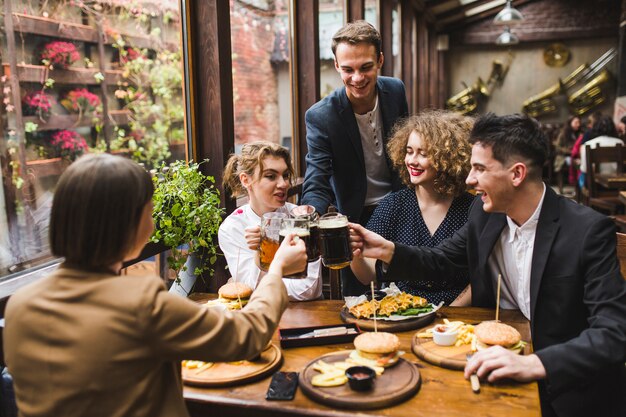 Friends eating and conversating in restaurant