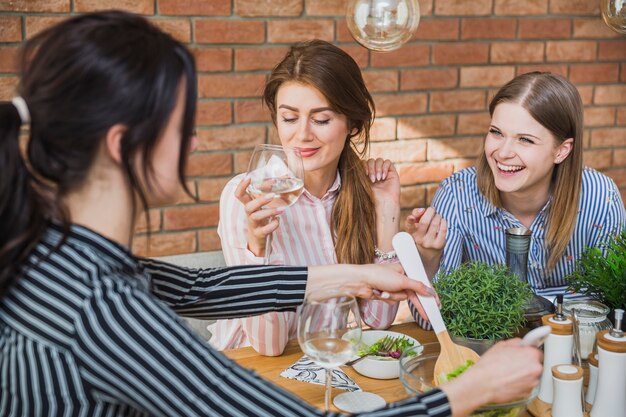 Friends eating and laughing