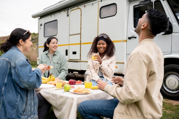 Free photo friends eating together medium shot