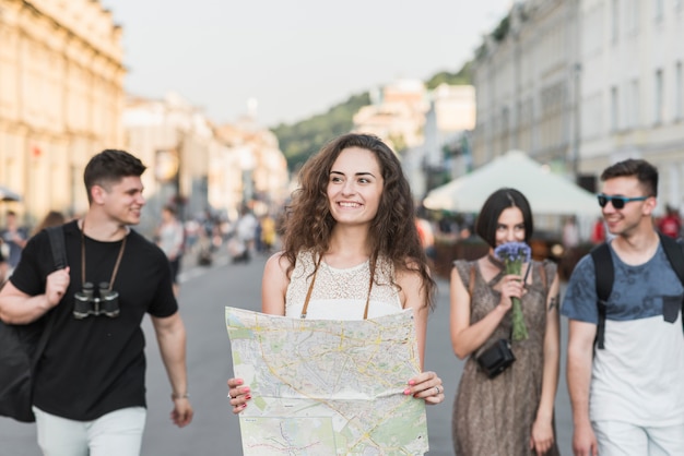 Friends exploring city with map