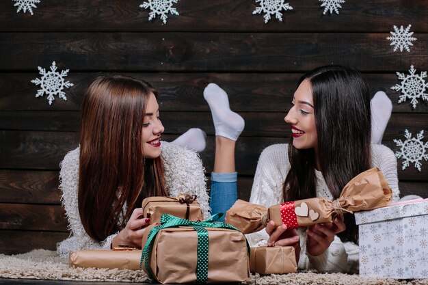 Friends giving christmas presents