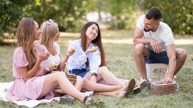 Friends hanging out together outside back to normal