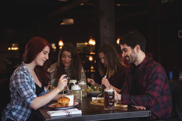 Friends having food in bar