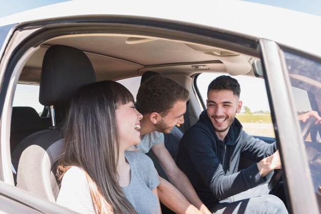 Friends having fun inside the car