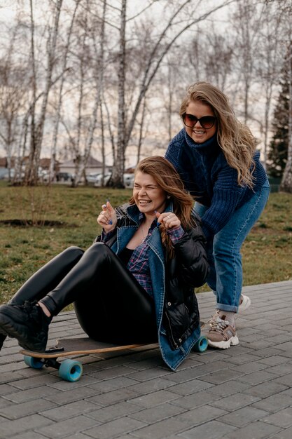 Friends having fun outdoors with skateboards