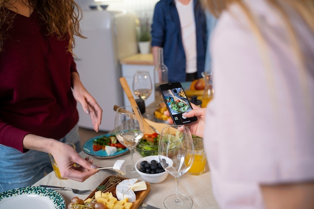 Friends having fun together while cooking