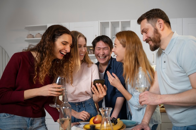 Friends having fun together while cooking