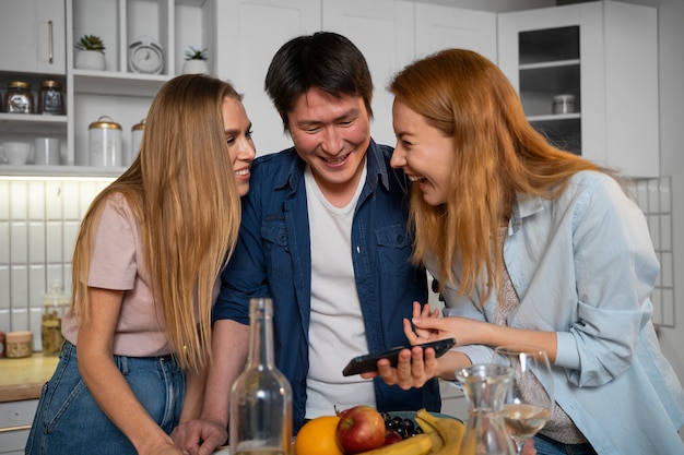 Friends having fun together while cooking